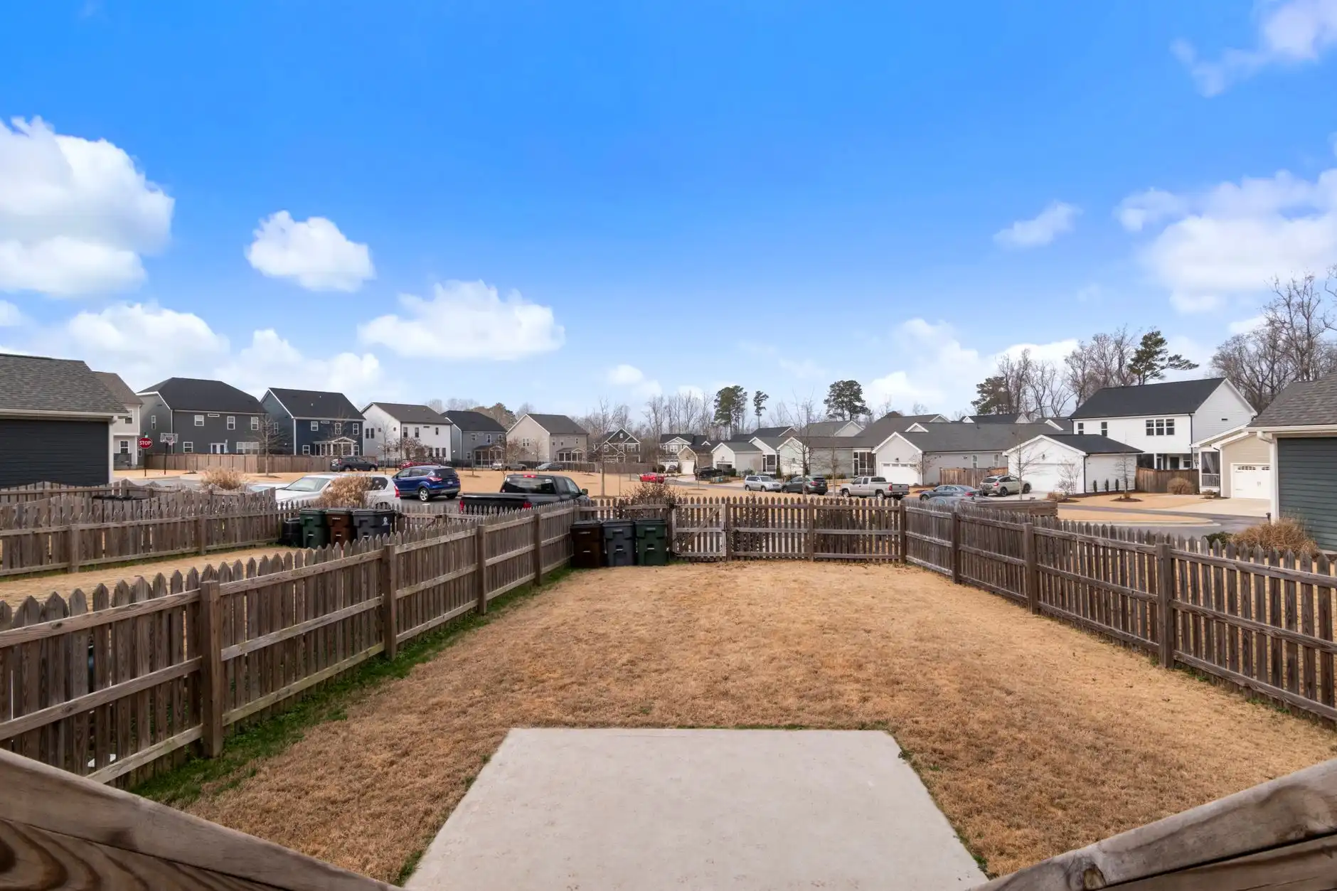 New wood privacy fencing enclosing suburban backyards
